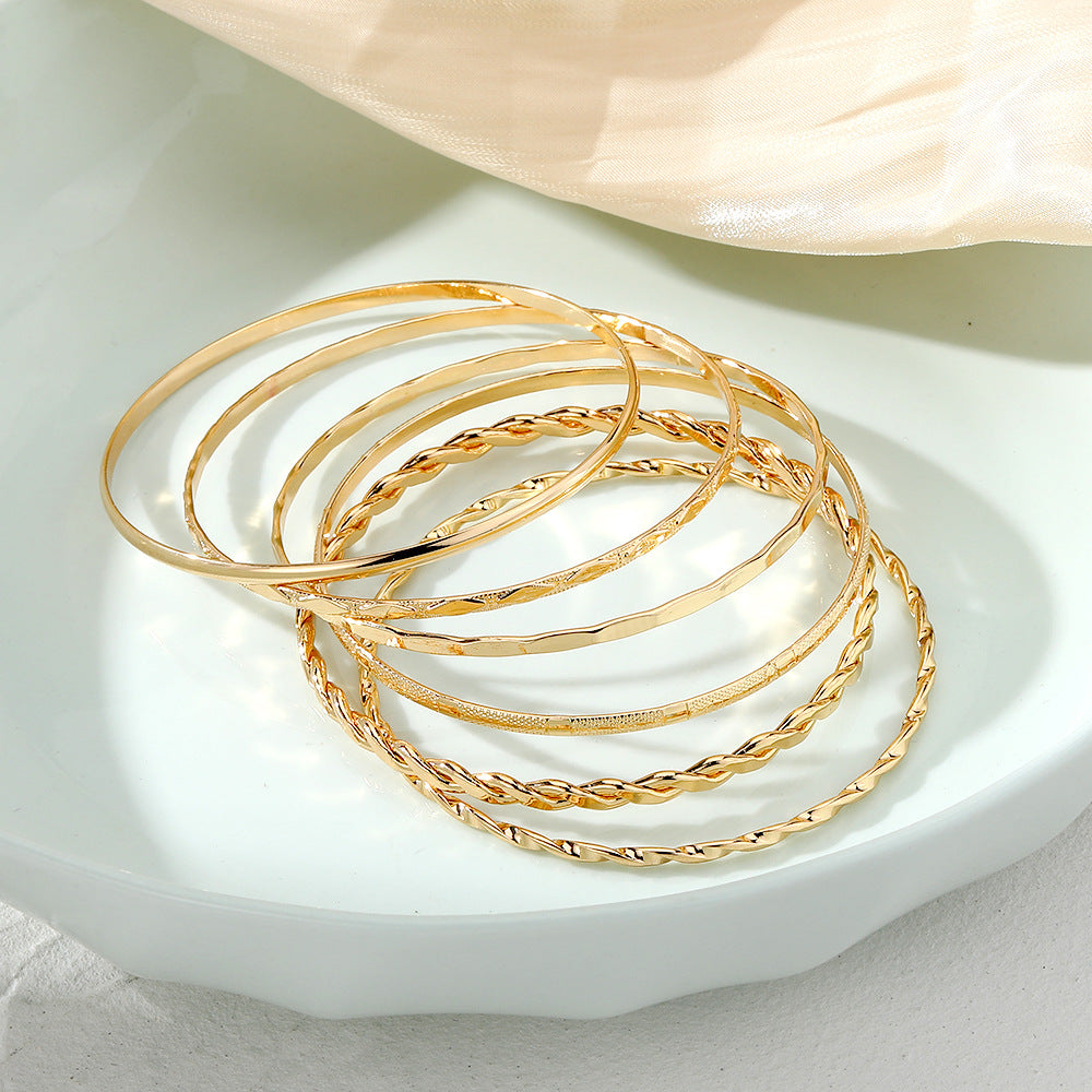 “Stacked Gold Fashion Bangles”